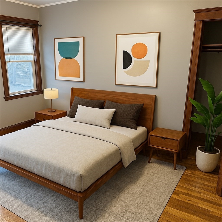 90 Boylston Street, Unit 1 Watertown, MA 02472 - Photo 14 of 16 a bedroom with a bed and painting on the wall