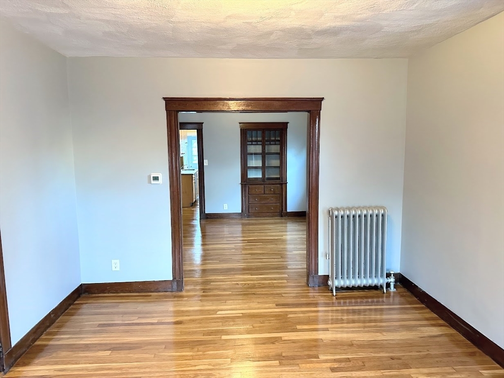 90 Boylston Street, Unit 1 Watertown, MA 02472 - Photo 5 of 16 a view of a room with wooden floor