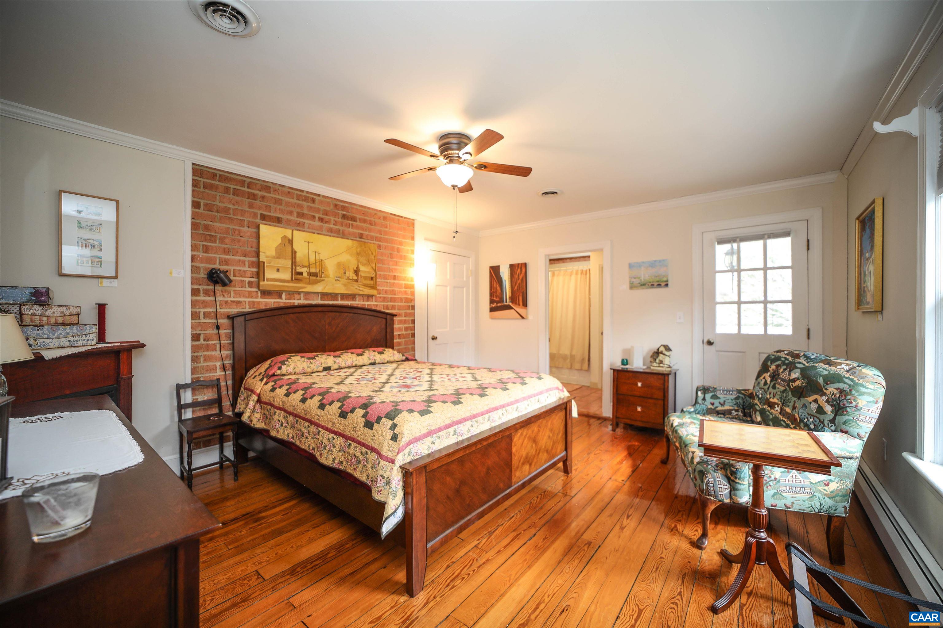325 Union Run Lexington, VA 24450 - Photo 28 of 56 a bedroom with a bed and wooden floor