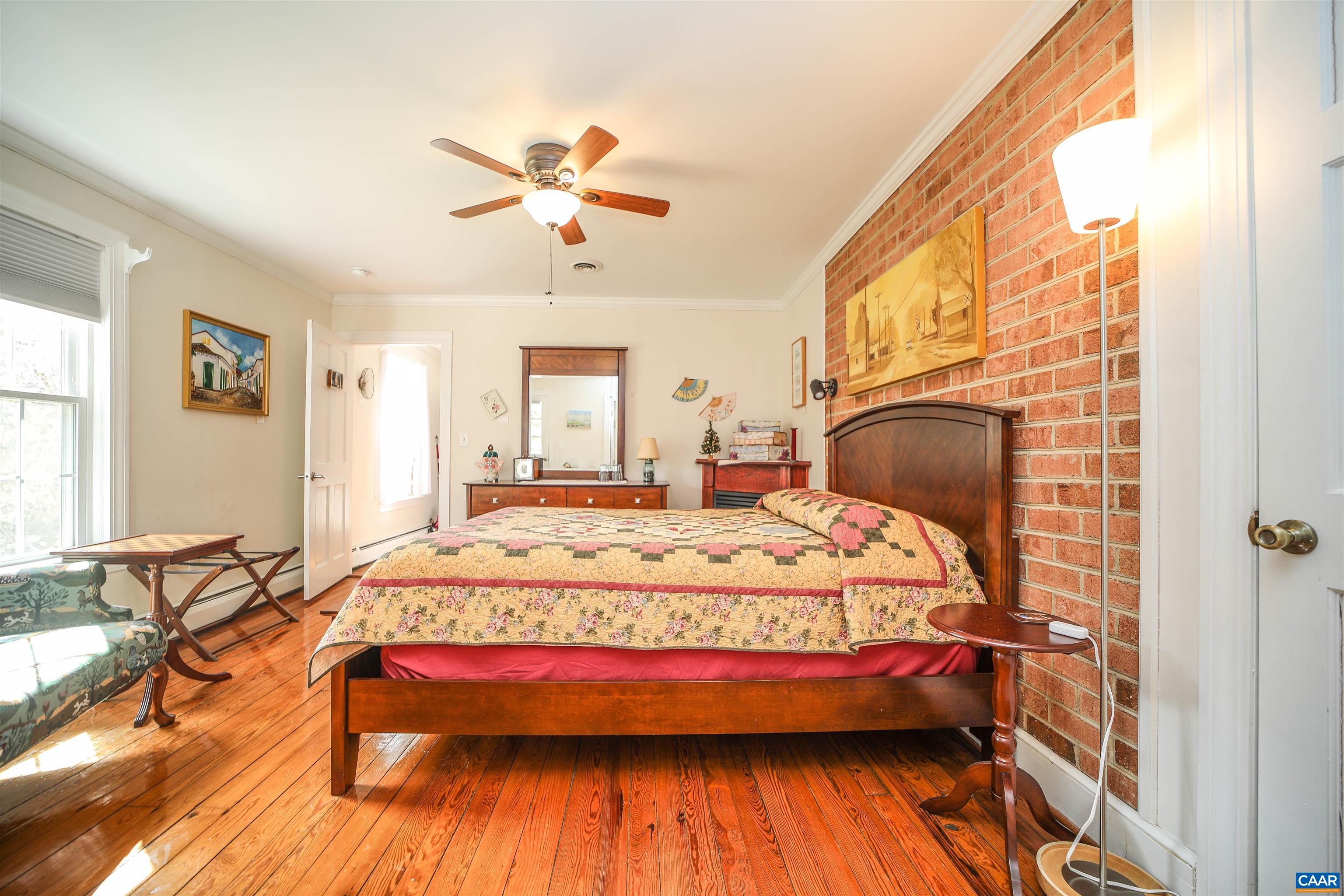 325 Union Run Lexington, VA 24450 - Photo 30 of 56 a bedroom with a bed and wooden floor