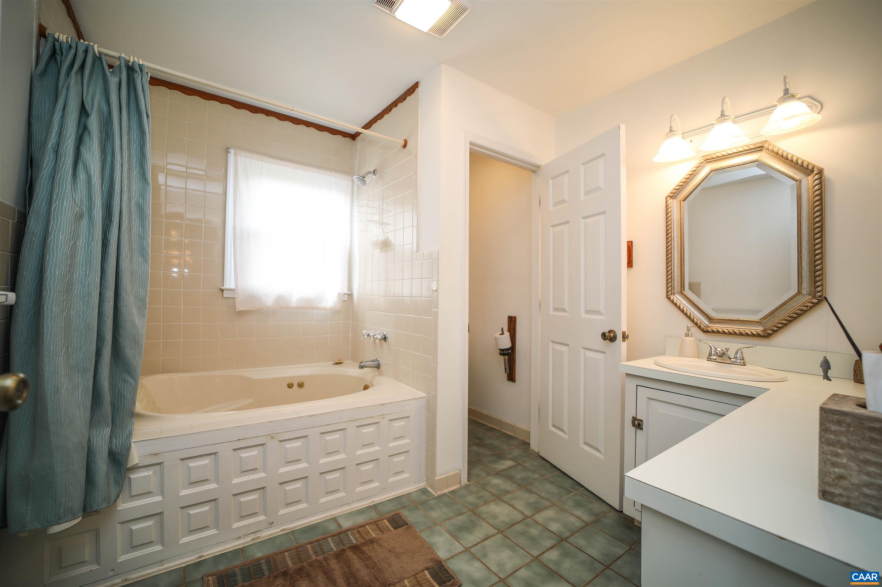 325 Union Run Lexington, VA 24450 - Photo 44 of 56 a bathroom with a tub sink and mirror