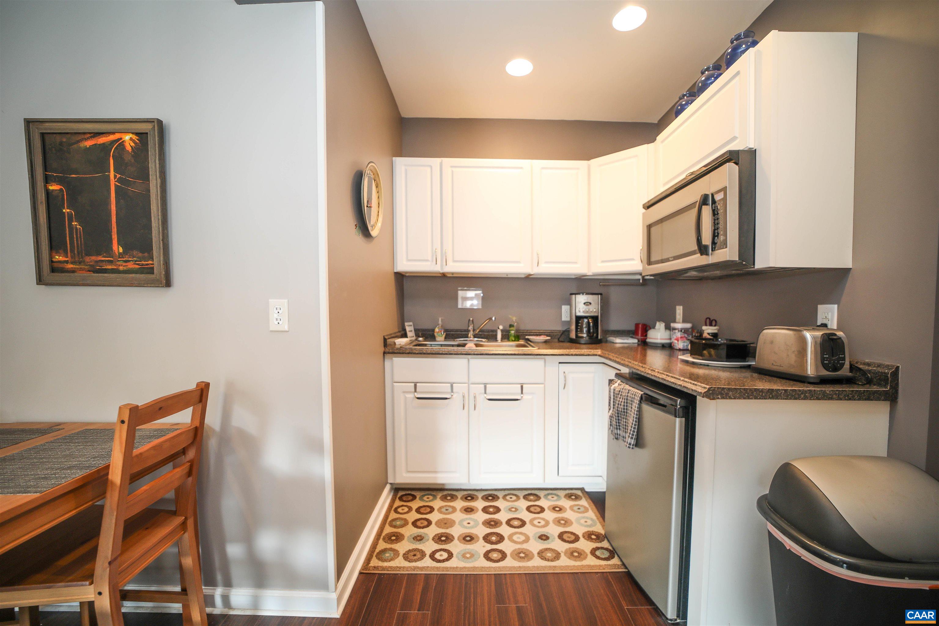 325 Union Run Lexington, VA 24450 - Photo 46 of 56 a kitchen with stainless steel appliances granite countertop a stove a sink and a microwave