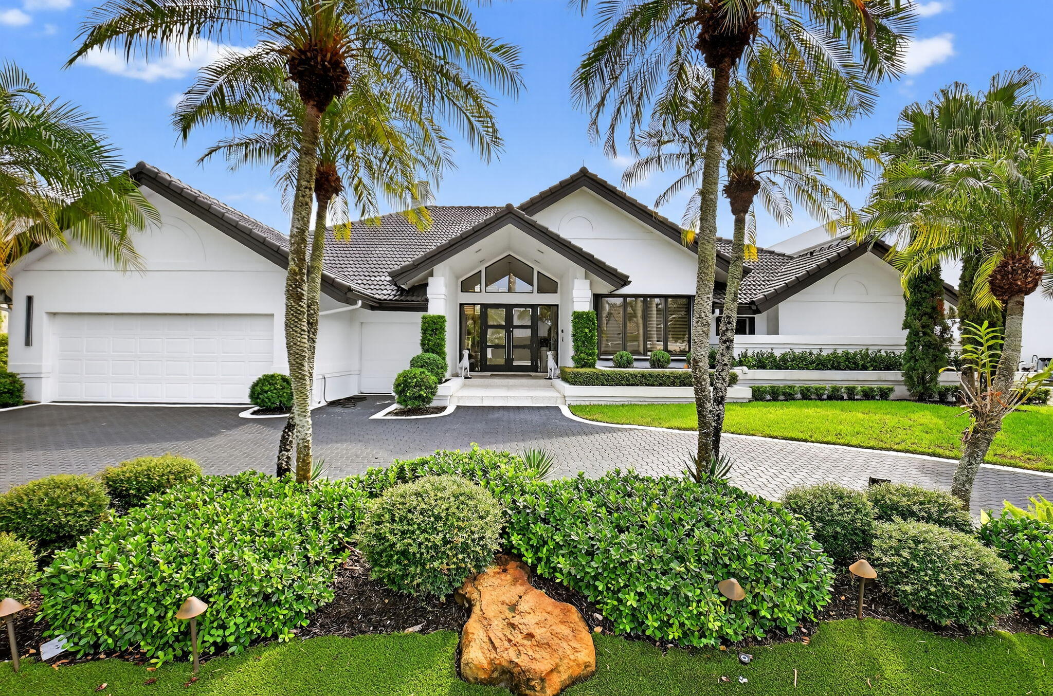 a house with palm tree in front of it