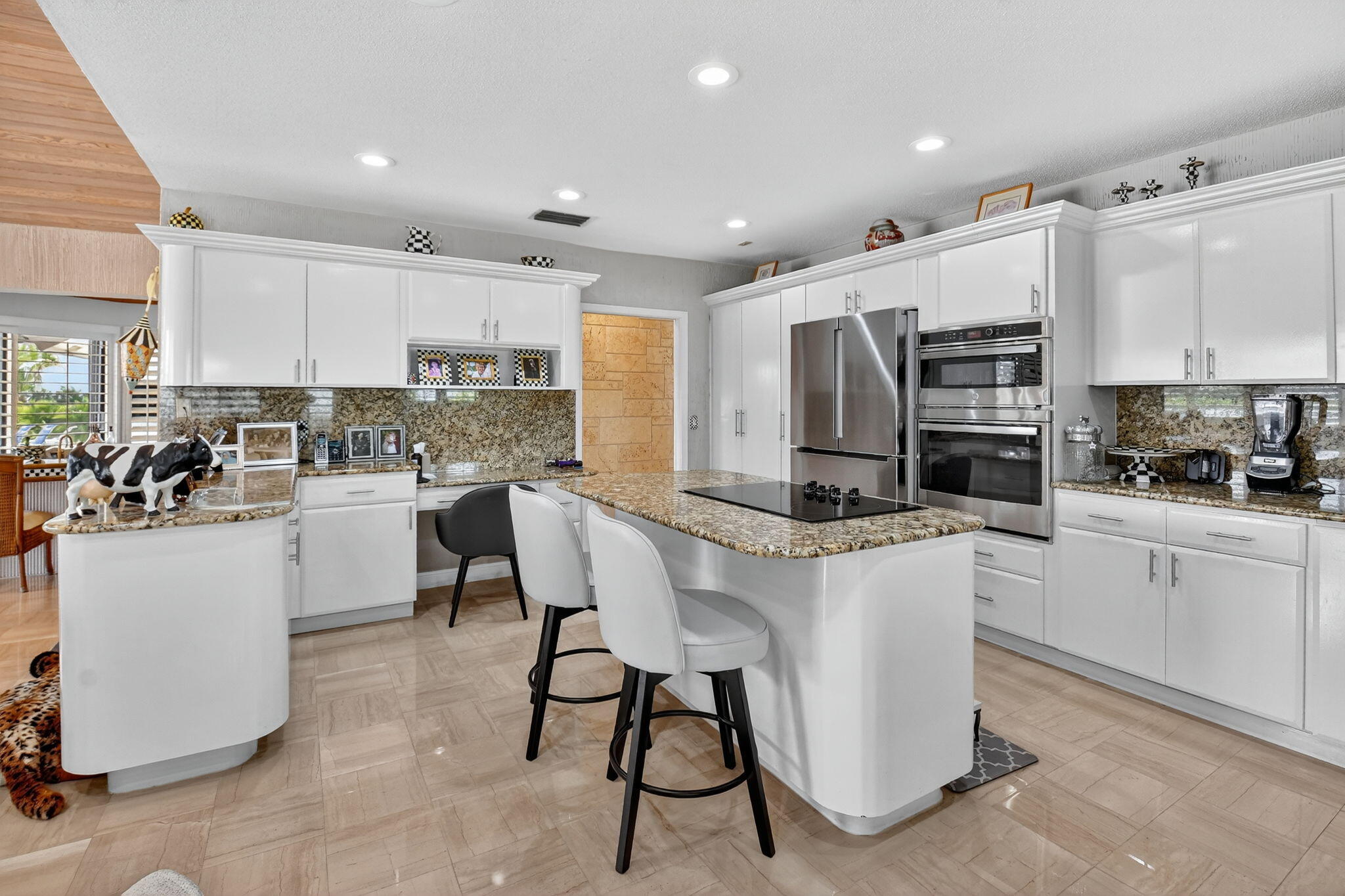 7336 Ballantrae Court Boca Raton, FL 33496 - Photo 12 of 32 a kitchen with appliances a sink and cabinets