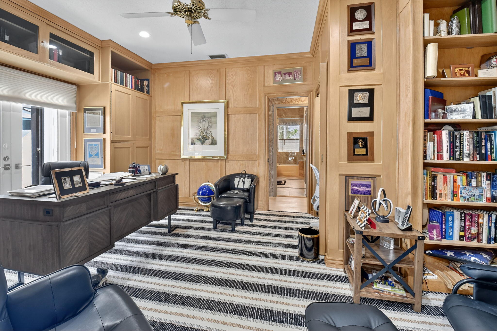7336 Ballantrae Court Boca Raton, FL 33496 - Photo 18 of 32 a living room with furniture and a book shelf