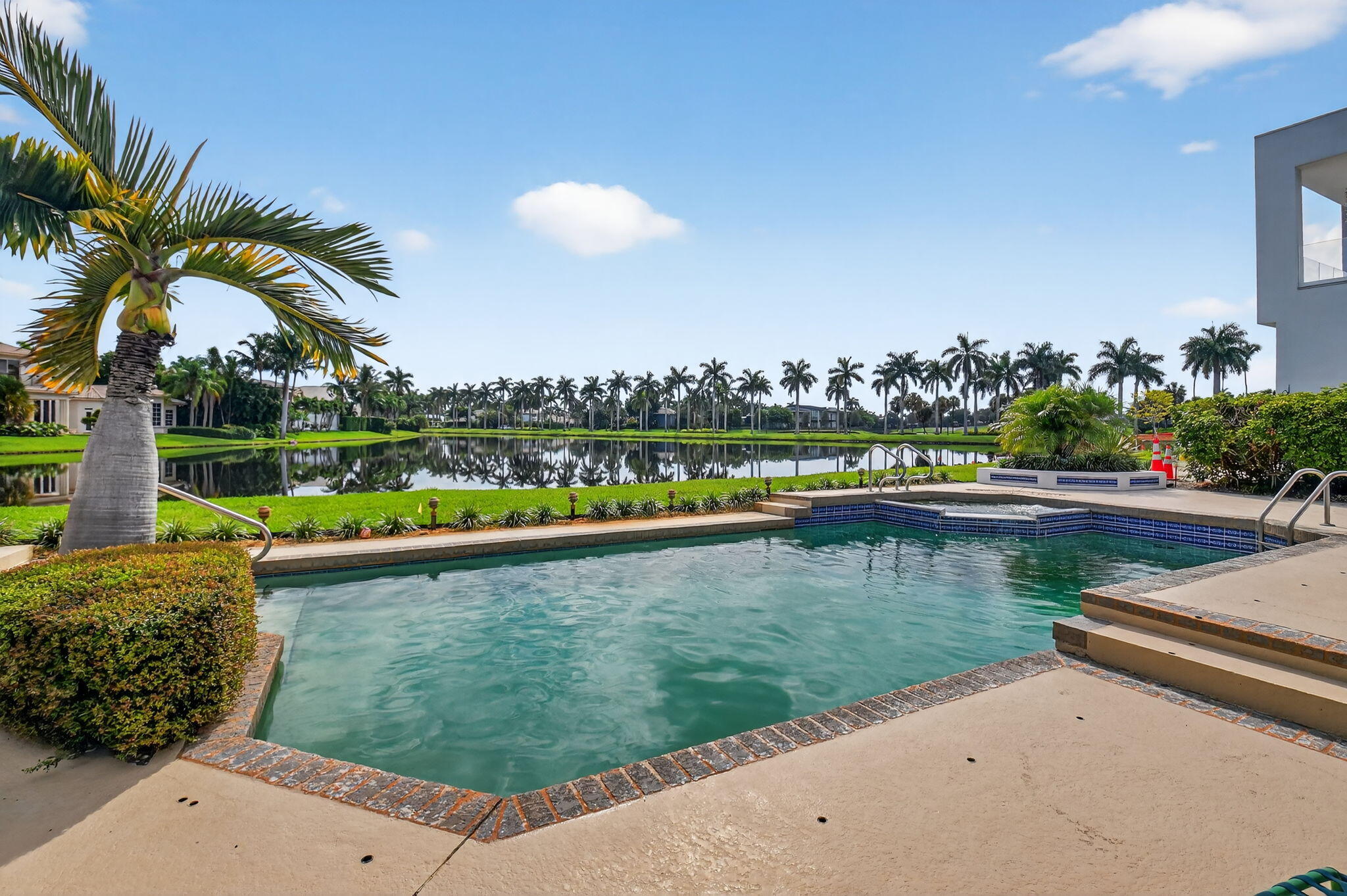 7336 Ballantrae Court Boca Raton, FL 33496 - Photo 23 of 32 a view of a lake with a building in the background