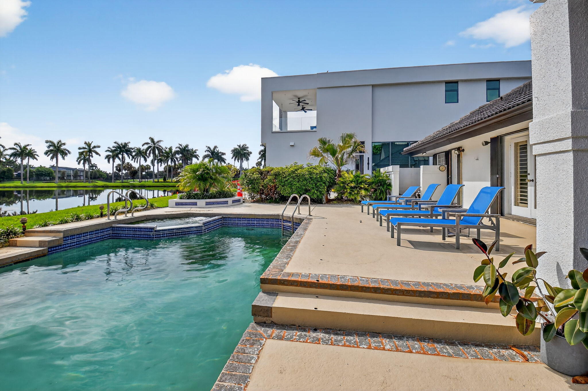 7336 Ballantrae Court Boca Raton, FL 33496 - Photo 24 of 32 a view of swimming pool with outdoor seating and lake view