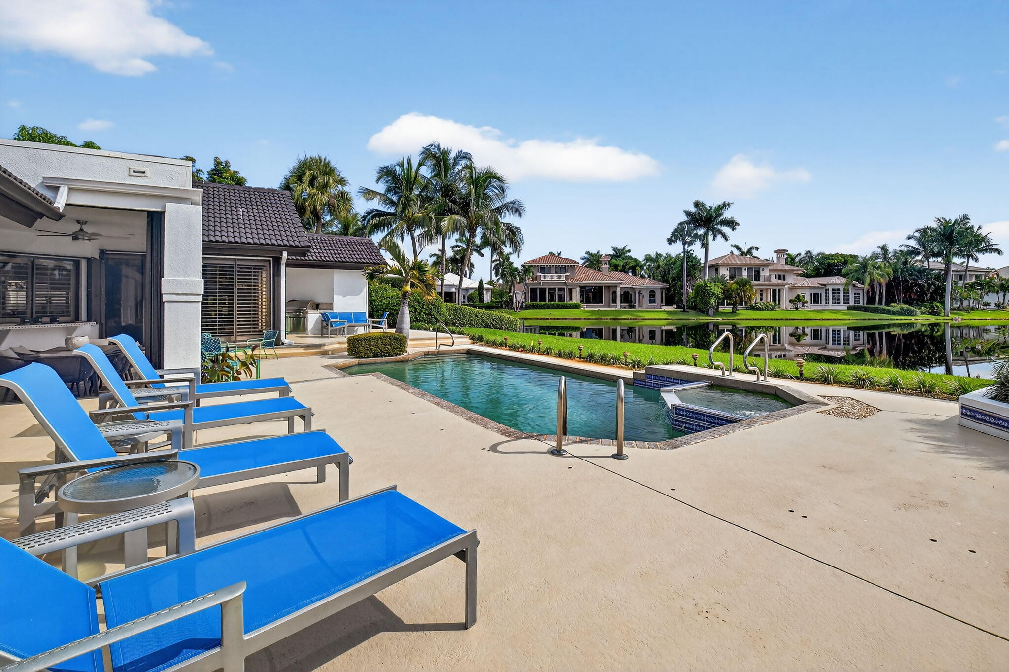 7336 Ballantrae Court Boca Raton, FL 33496 - Photo 25 of 32 a swimming pool with outdoor seating and yard