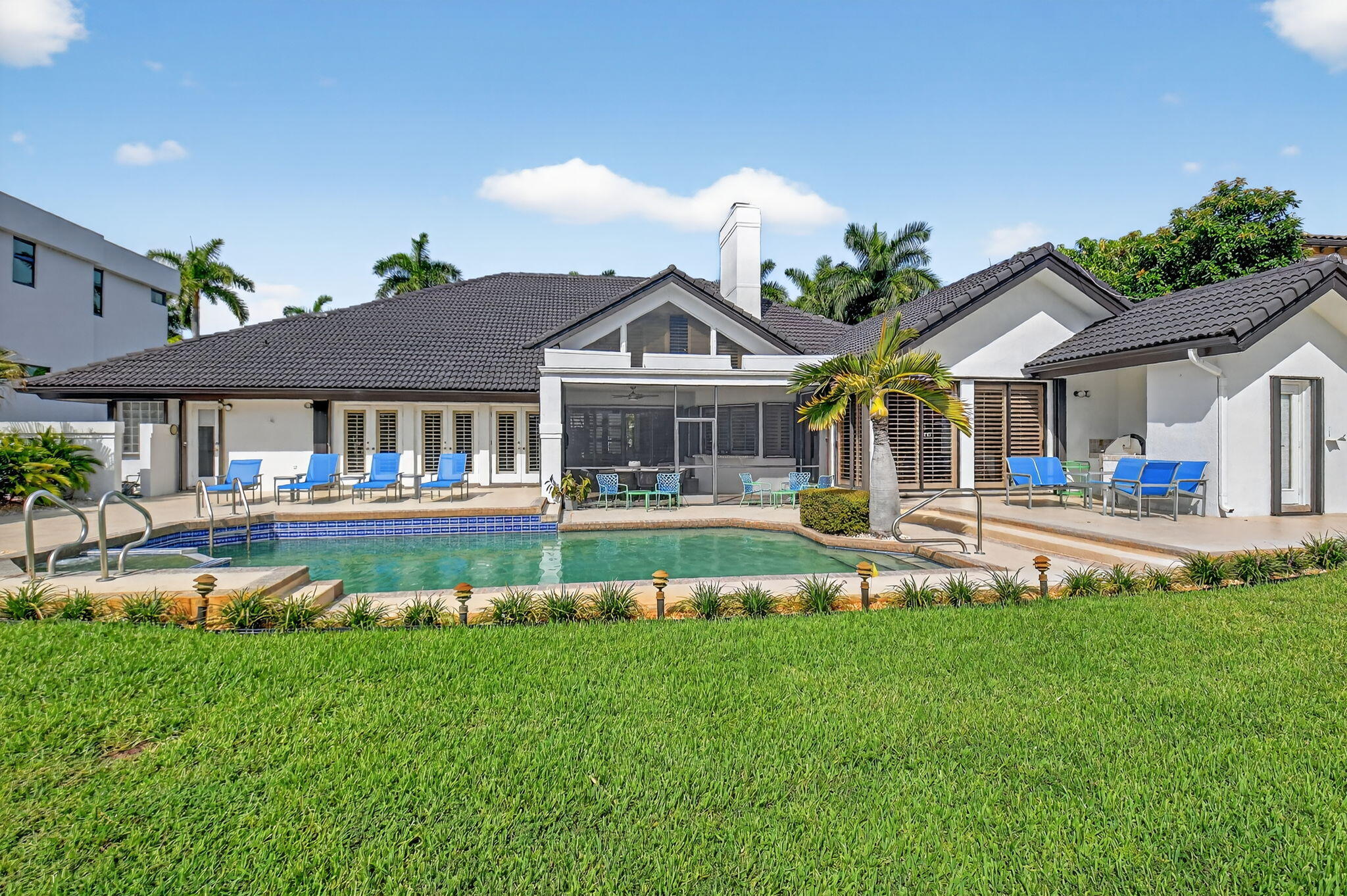 7336 Ballantrae Court Boca Raton, FL 33496 - Photo 28 of 32 a front view of a house with garden and swimming pool