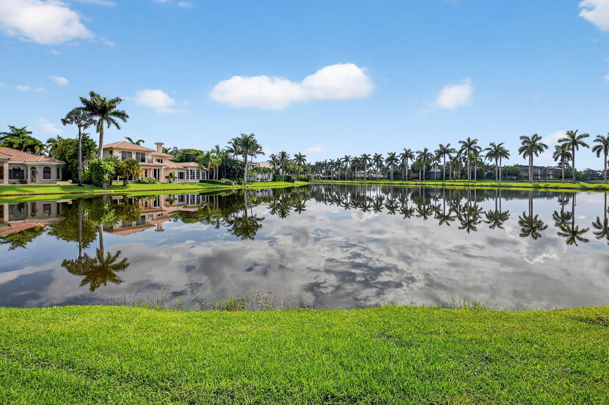 7336 Ballantrae Court Boca Raton, FL 33496 - Photo 3 of 32 a view of a lake with a table and chairs