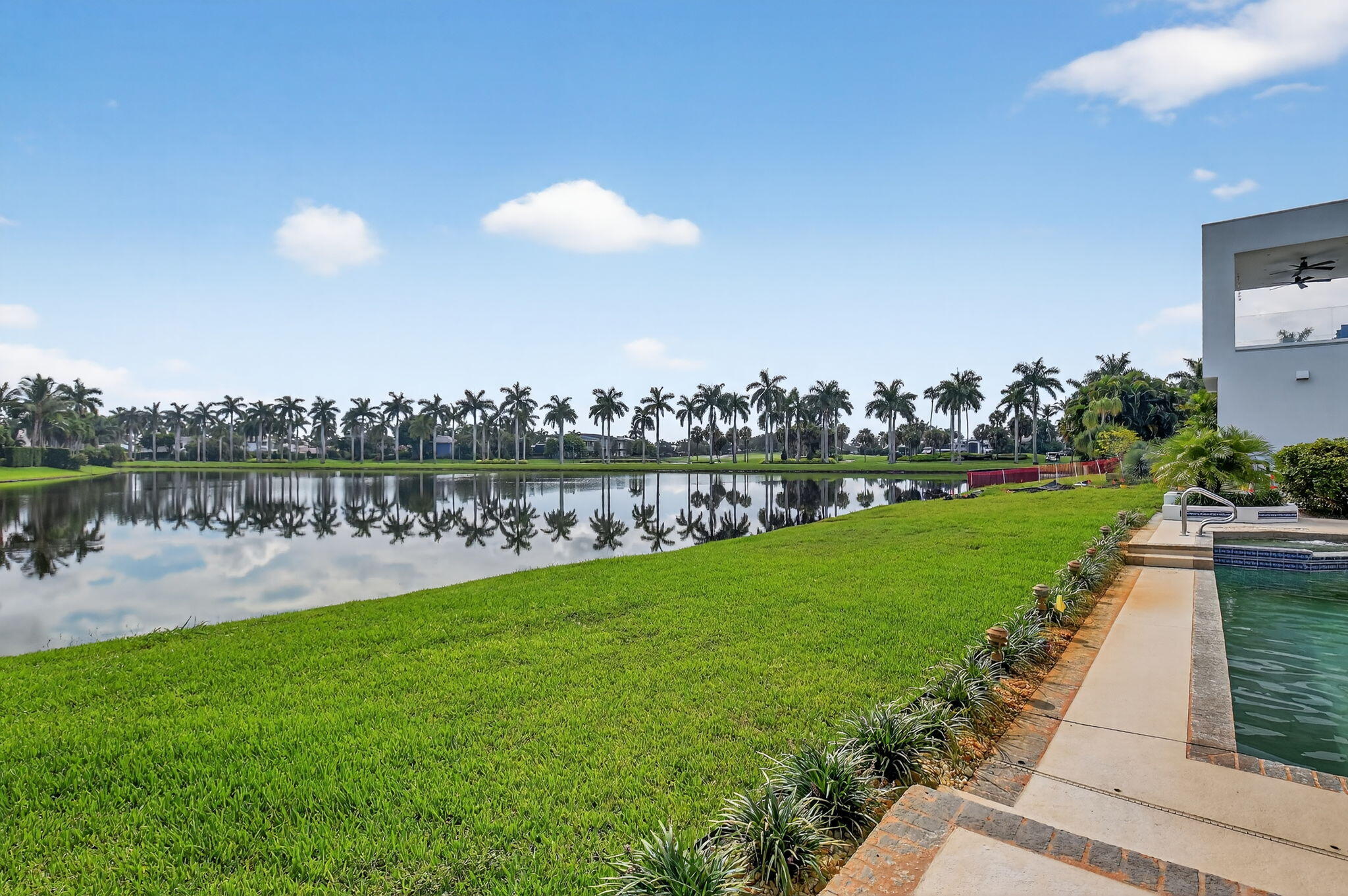 7336 Ballantrae Court Boca Raton, FL 33496 - Photo 32 of 32 a view of a lake with houses in the back