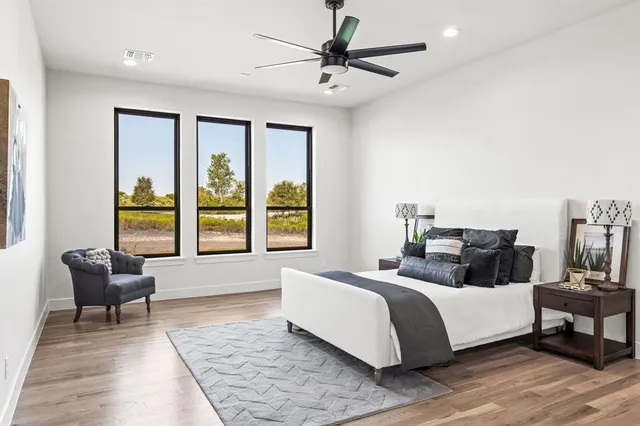 a bedroom with a bed and a couch