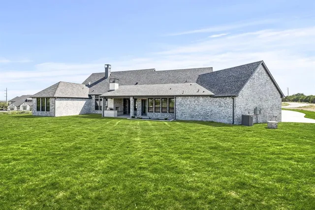 a front view of house with garden