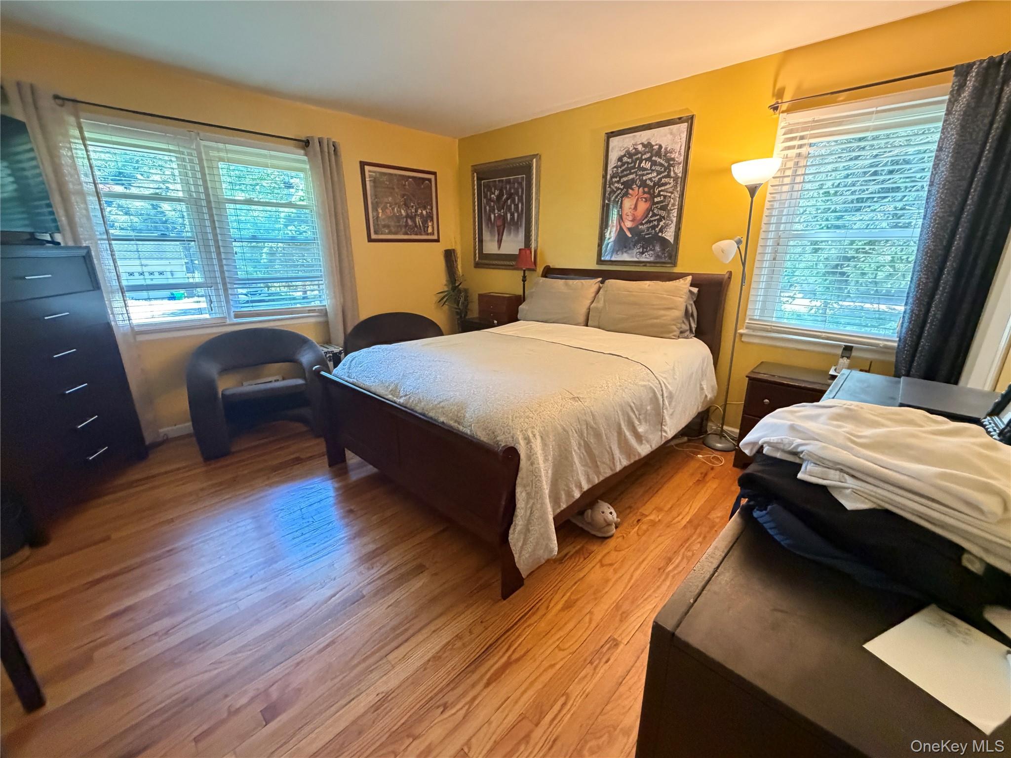 17 Mallory Road Spring Valley, NY 10977 - Photo 16 of 26 a bedroom with a bed and a large window