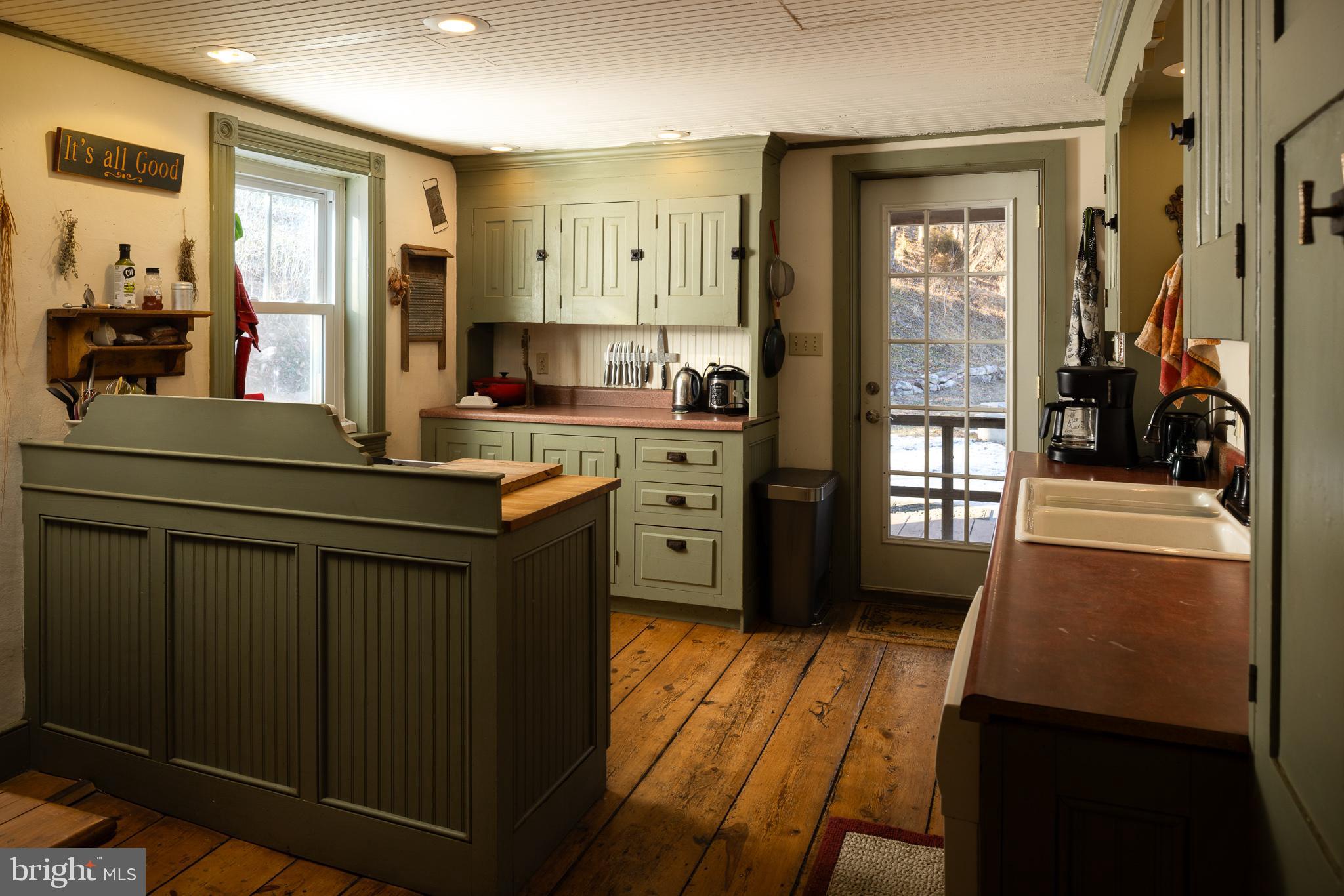 333 New Bethel Church Road Kempton, PA 19529 - Photo 21 of 48 a kitchen with stainless steel appliances a sink stove and cabinets