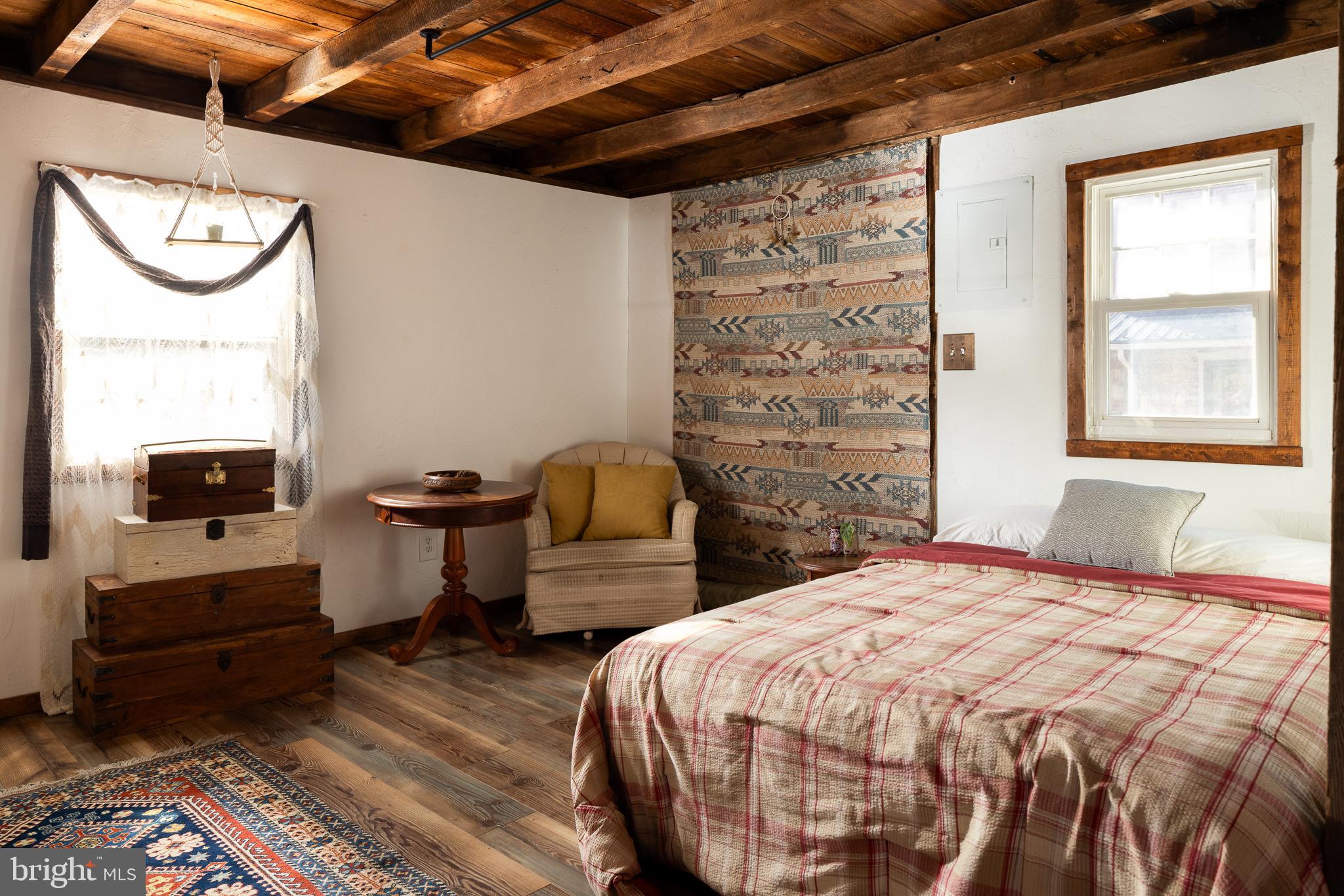 333 New Bethel Church Road Kempton, PA 19529 - Photo 22 of 48 a bedroom with a bed and wooden floor