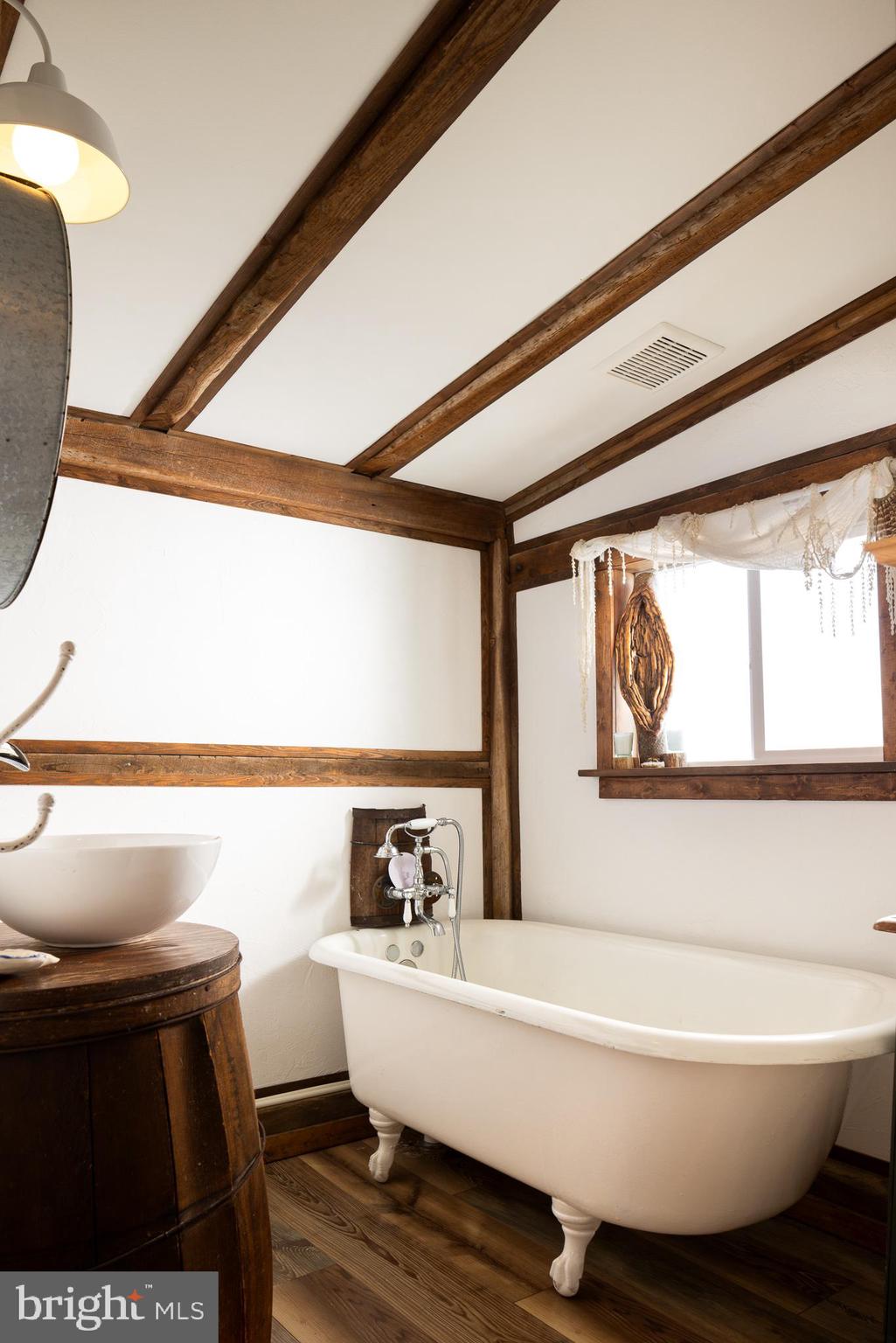 333 New Bethel Church Road Kempton, PA 19529 - Photo 23 of 48 a bathroom with a bathtub and window