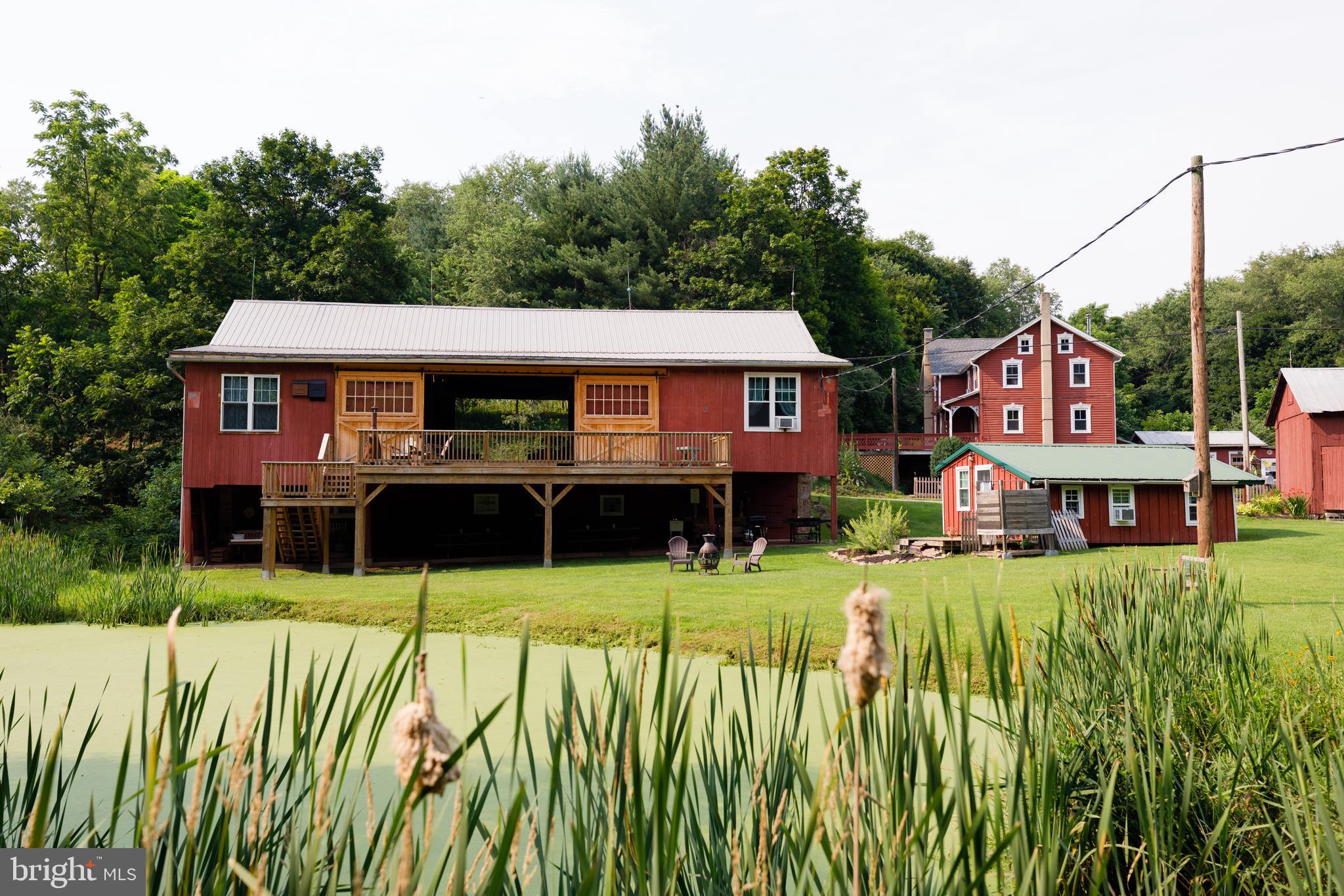 333 New Bethel Church Road Kempton, PA 19529 - Photo 26 of 48 a front view of a house with a yard table and chairs