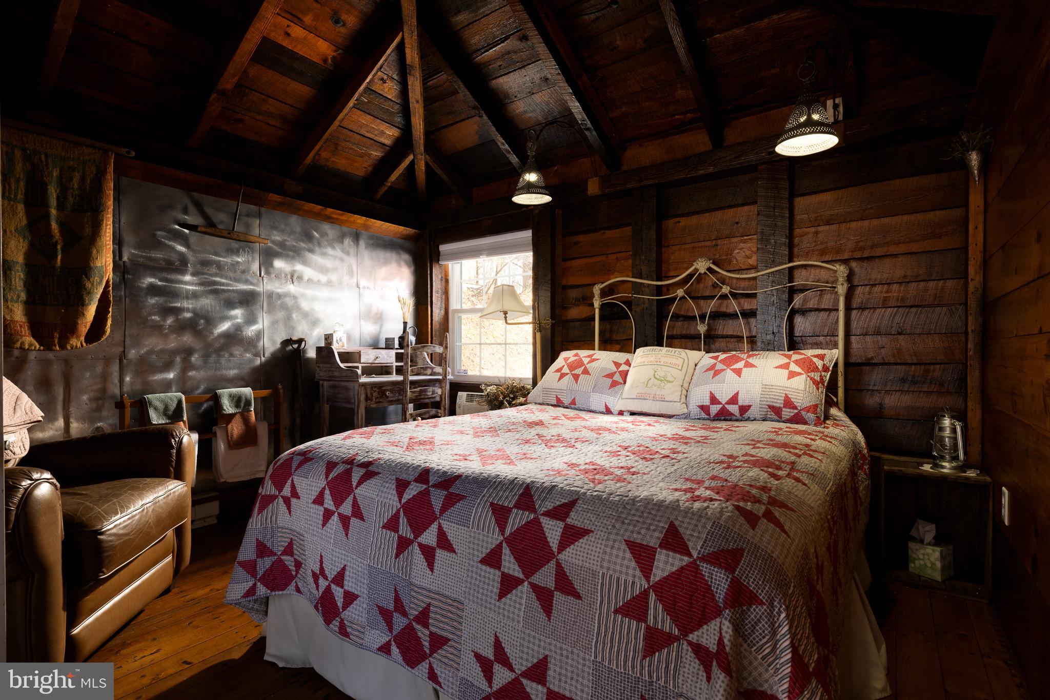 333 New Bethel Church Road Kempton, PA 19529 - Photo 40 of 48 a bedroom with bed and wooden floor