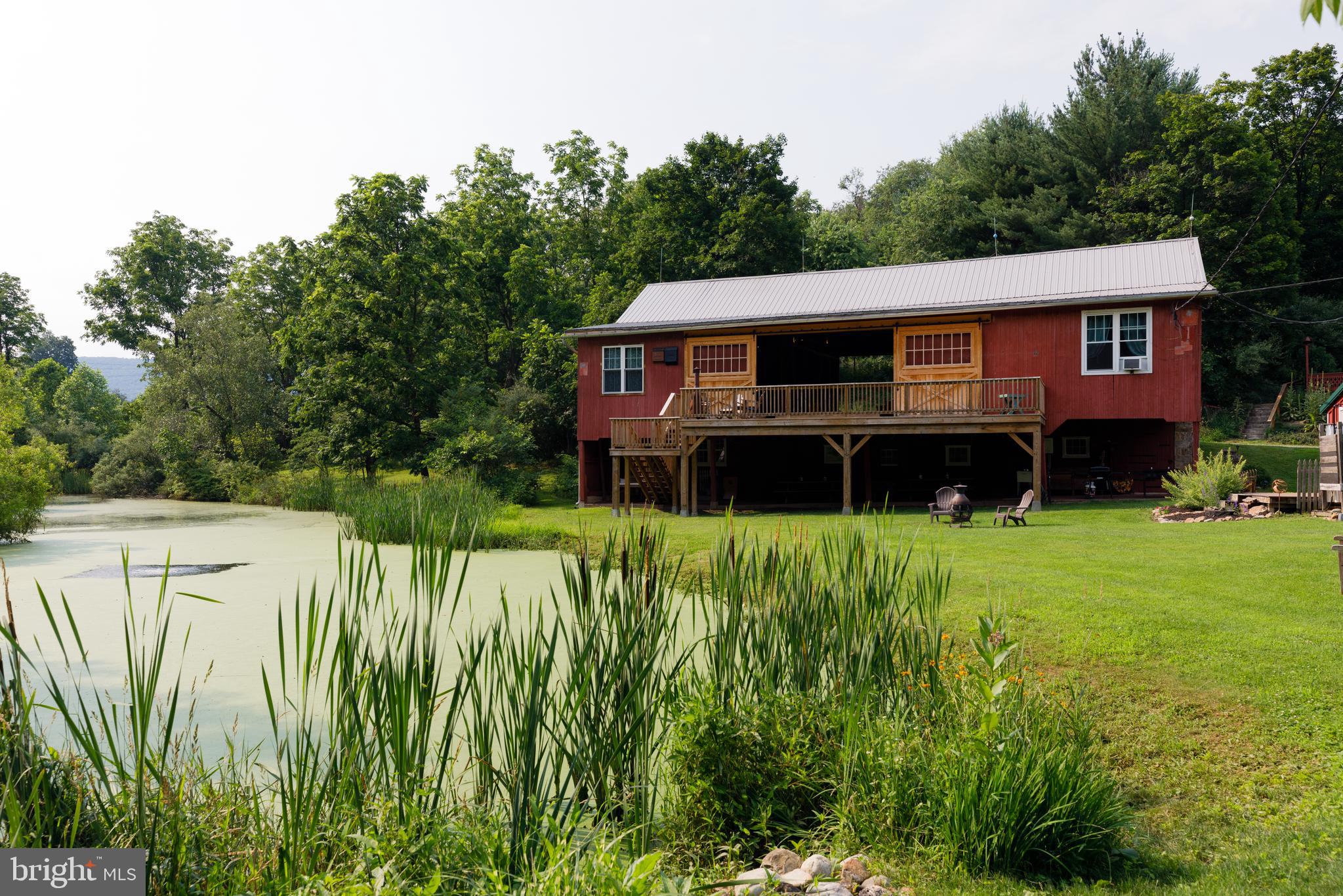 333 New Bethel Church Road Kempton, PA 19529 - Photo 4 of 48 a view of a house with a big yard plants and large trees