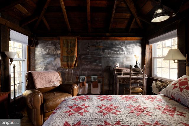an aerial view of a house with outdoor space