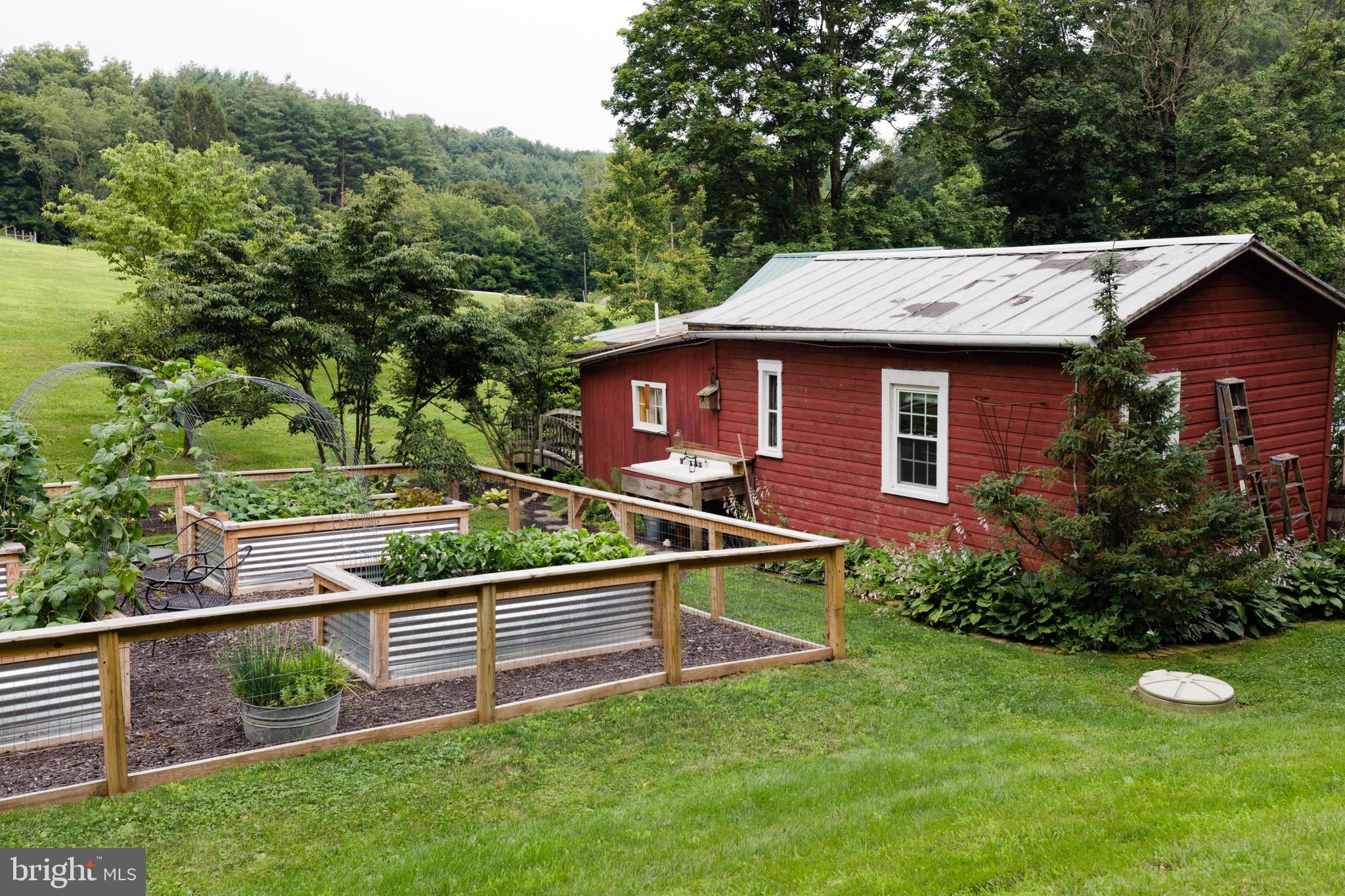 333 New Bethel Church Road Kempton, PA 19529 - Photo 10 of 48 a view of a house with a backyard