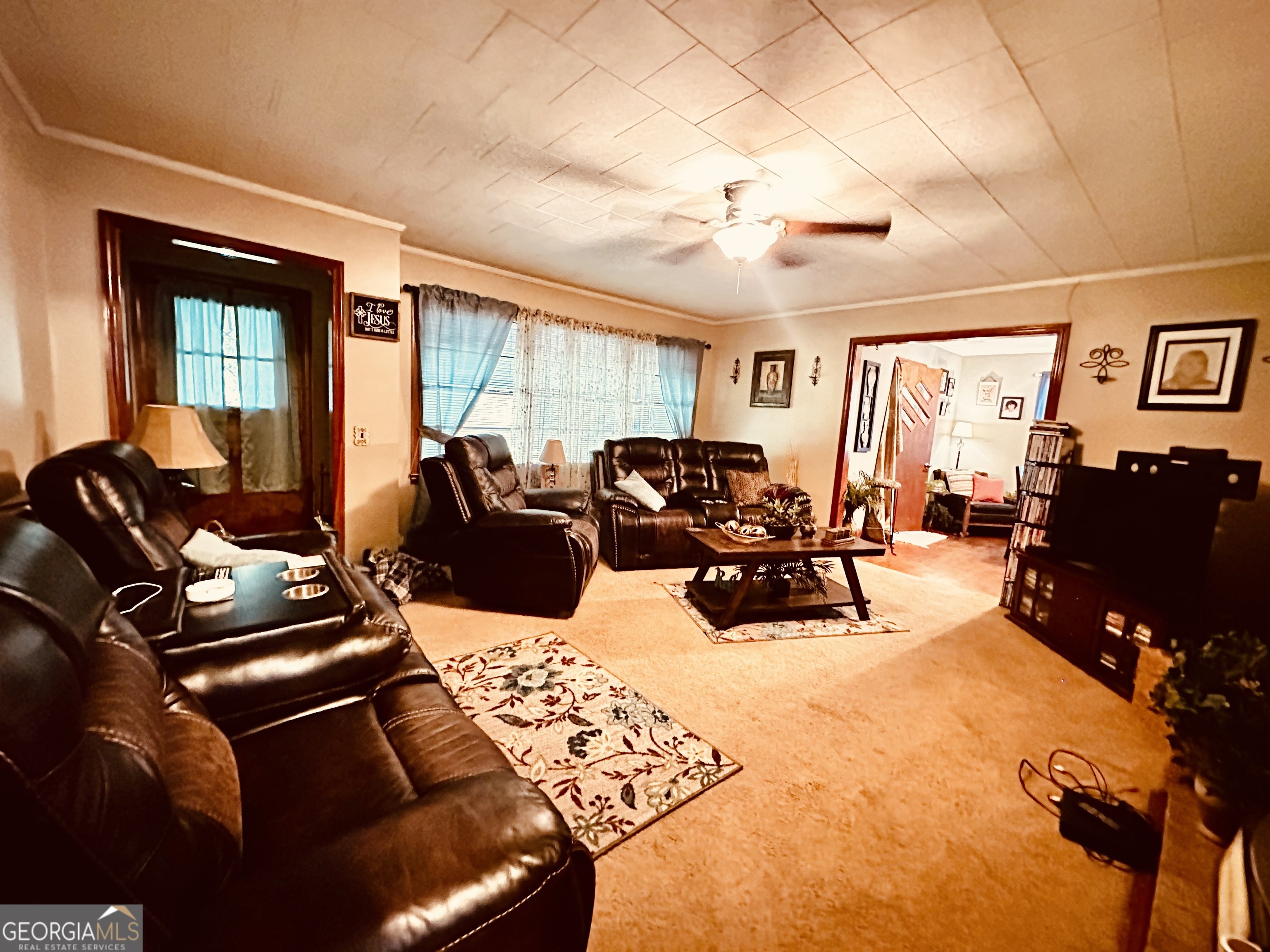45 Mt Zion Street Milan, GA 31060 - Photo 13 of 27 a living room with furniture a couch and large windows