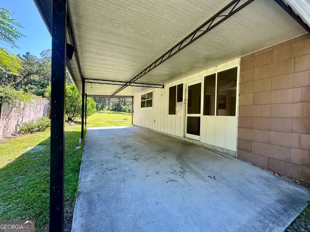 a view of an empty room with a yard