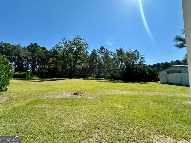 a view of a swimming pool and an outdoor space