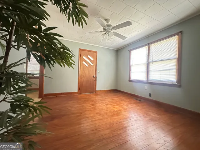 a view of an empty room and window