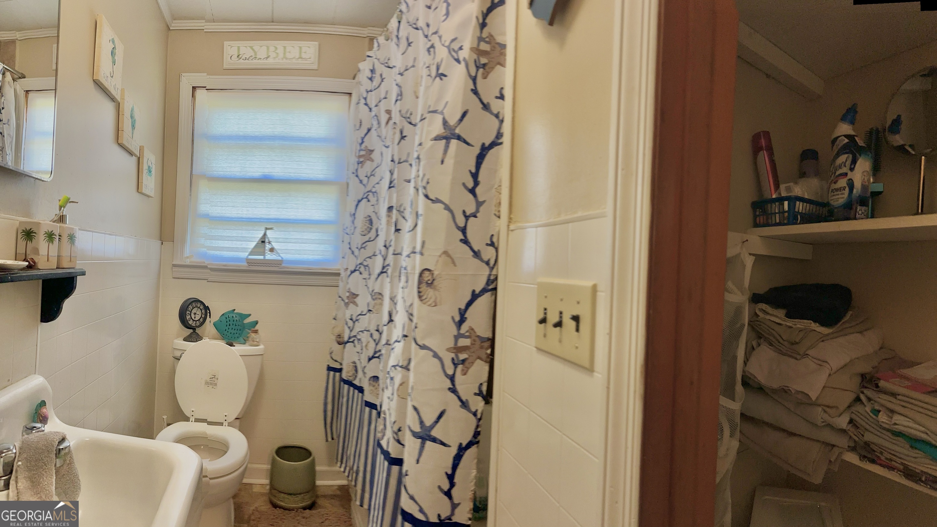 45 Mt Zion Street Milan, GA 31060 - Photo 22 of 27 a bathroom with a toilet and shower curtain