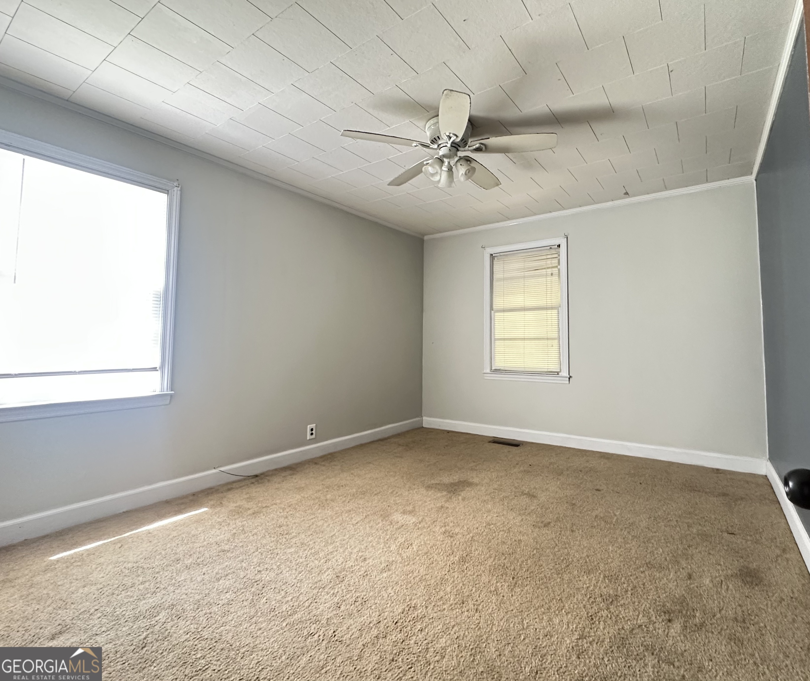 45 Mt Zion Street Milan, GA 31060 - Photo 24 of 27 an empty room with a window and a fan