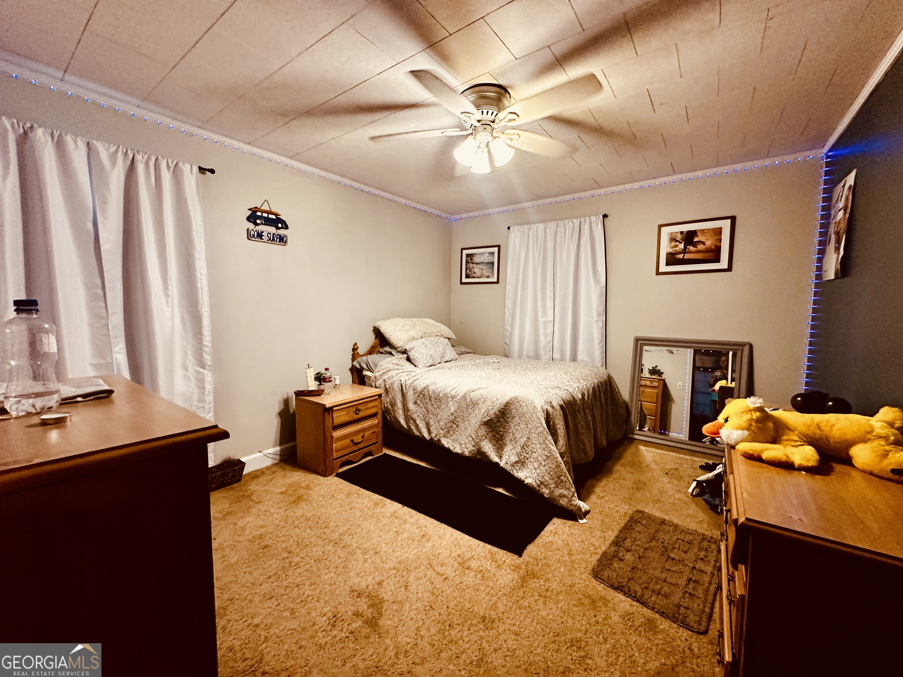 45 Mt Zion Street Milan, GA 31060 - Photo 8 of 27 a bedroom with a bed and a chandelier