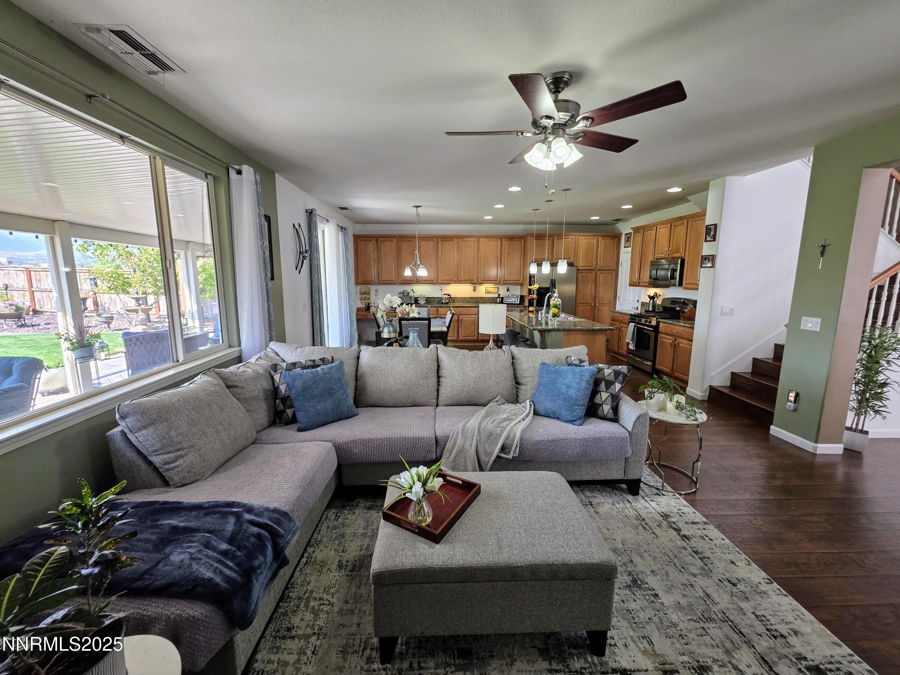 10677 Fire Poppy Circle Reno, NV 89521 - Photo 12 of 45 a living room with furniture and a large window