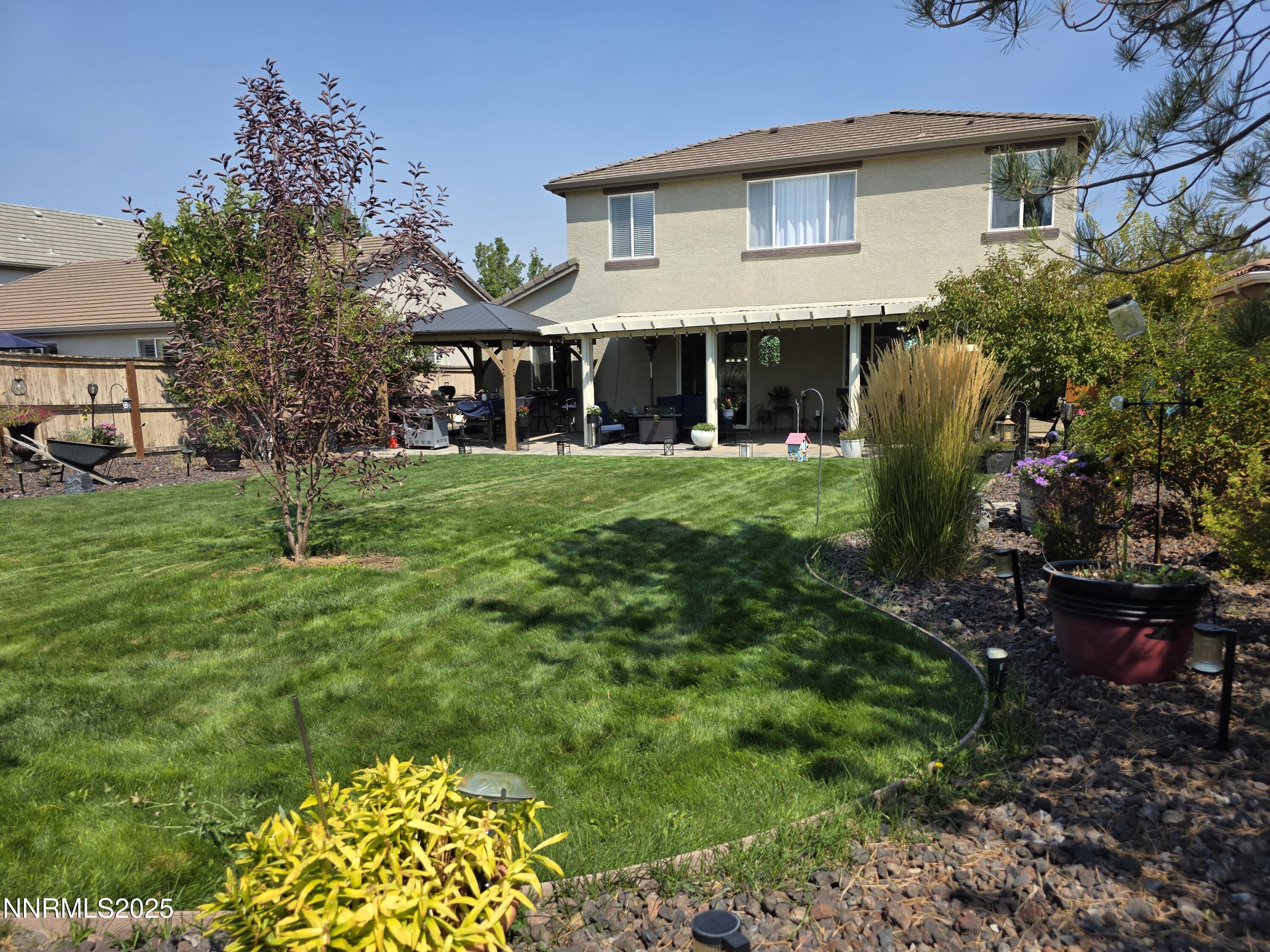 10677 Fire Poppy Circle Reno, NV 89521 - Photo 26 of 45 a front view of a house with a yard