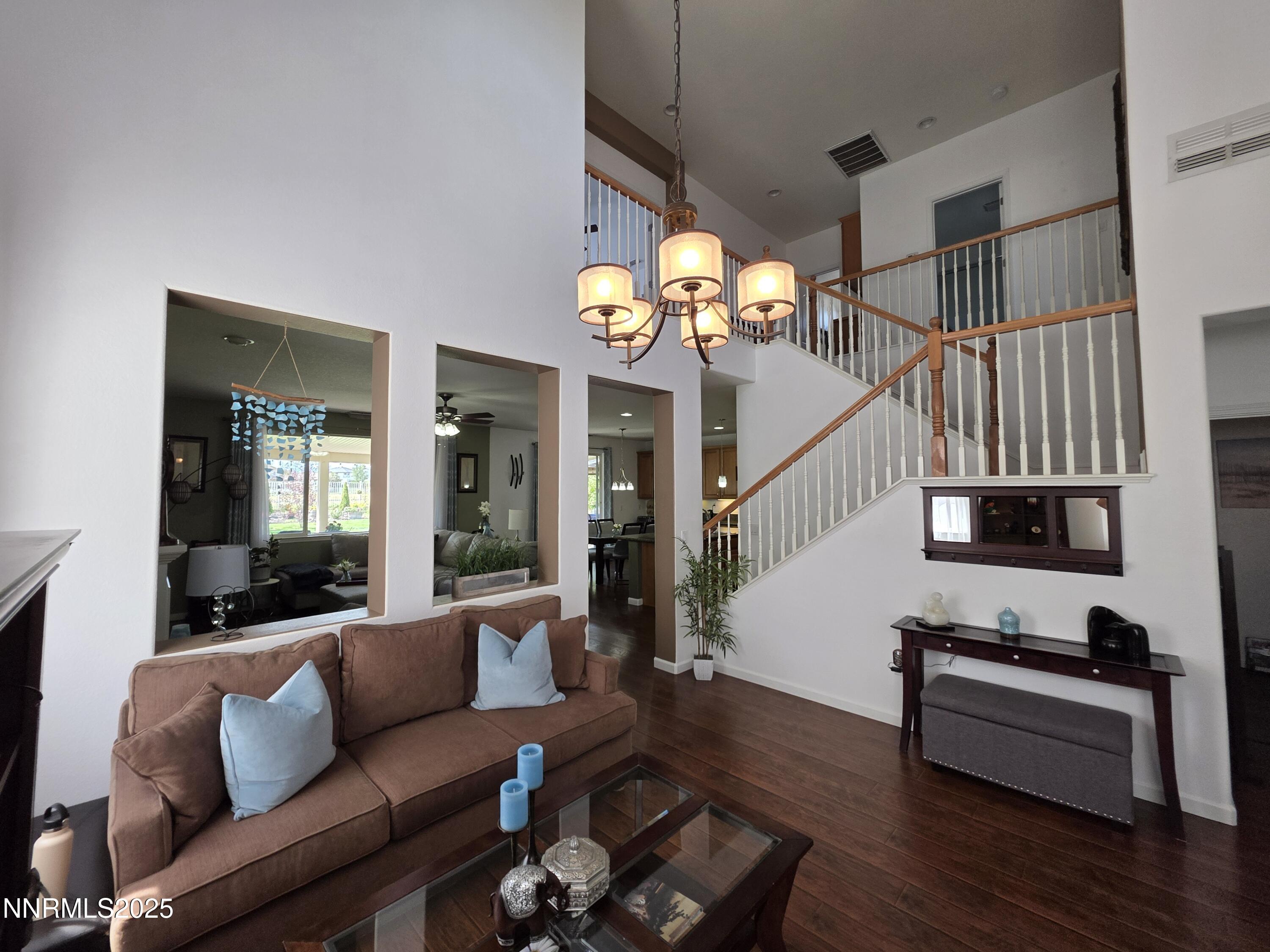 10677 Fire Poppy Circle Reno, NV 89521 - Photo 40 of 45 a living room with furniture and a chandelier