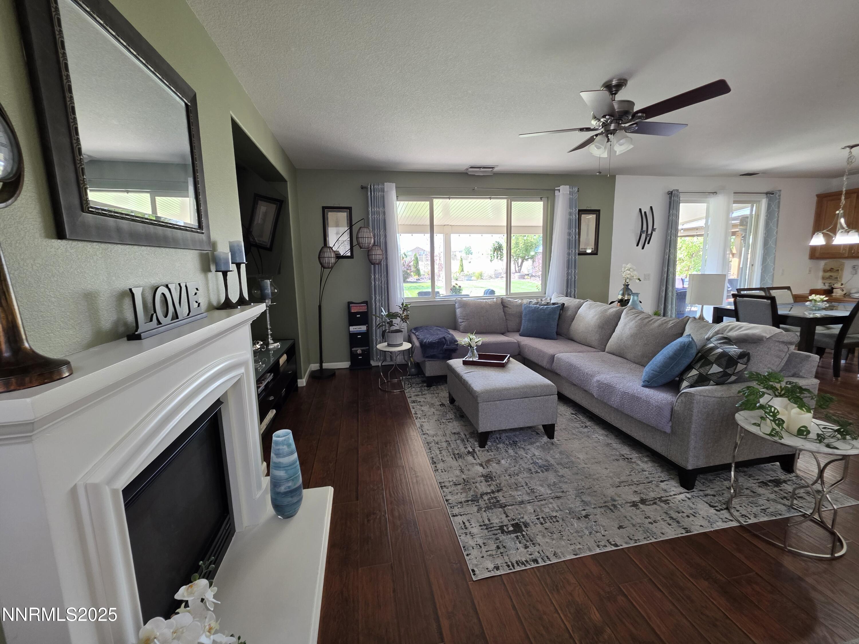 10677 Fire Poppy Circle Reno, NV 89521 - Photo 10 of 45 a living room with furniture and a fireplace