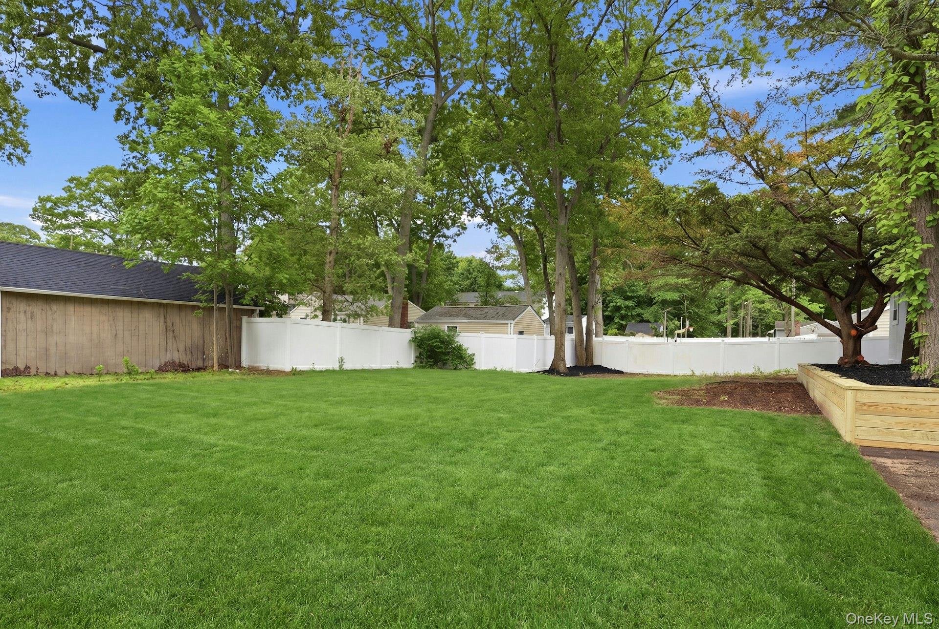 101 Rustic Road Centereach, NY 11720 - Photo 3 of 42 a view of a yard with a tree