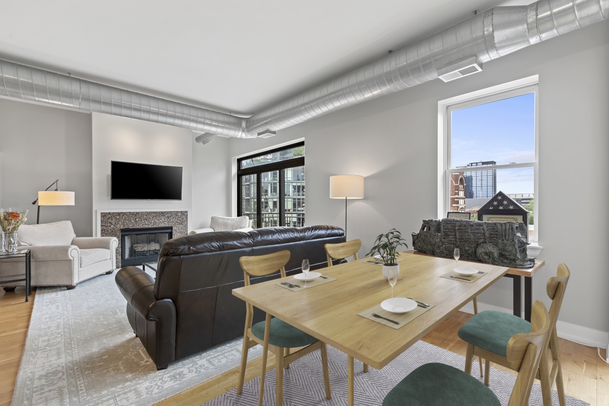 1155 West Madison Street, Unit 603 Chicago, IL 60607 - Photo 2 of 23 a view of a dining room with furniture and wooden floor