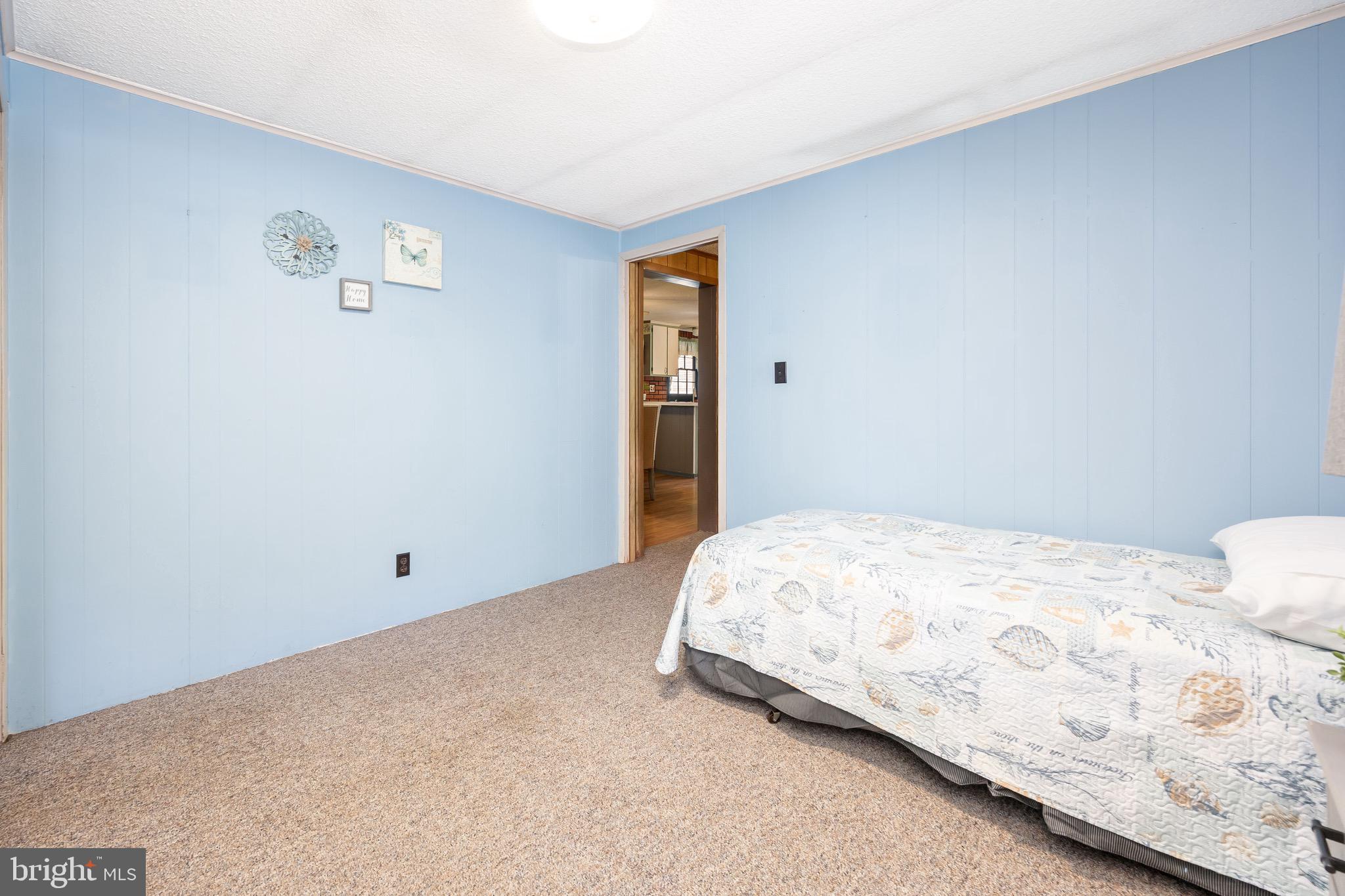 11060 Roland Parks Road Chance, MD 21821 - Photo 33 of 60 a bedroom with a bed and a window
