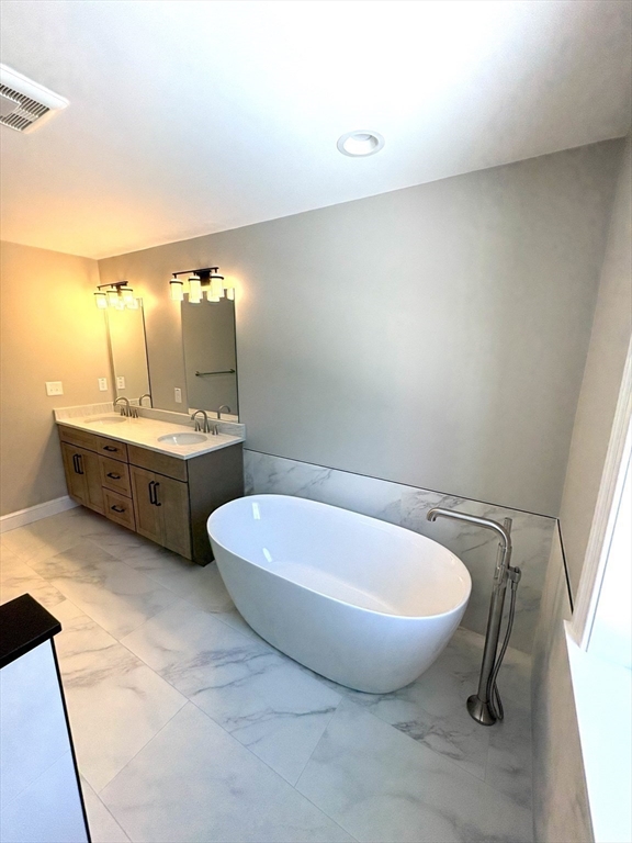 29 Range Avenue Taunton, MA 02780 - Photo 26 of 37 a bathroom with a tub sink and mirror