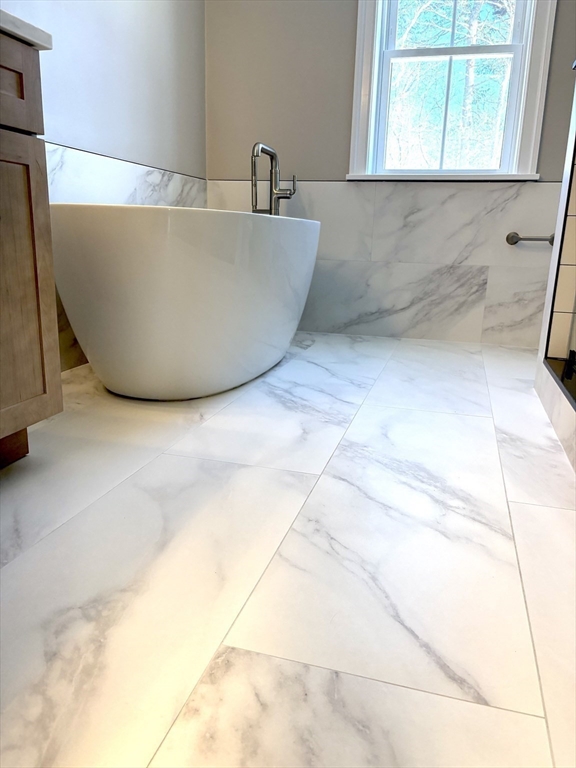 29 Range Avenue Taunton, MA 02780 - Photo 27 of 37 a white tub sitting next to a window