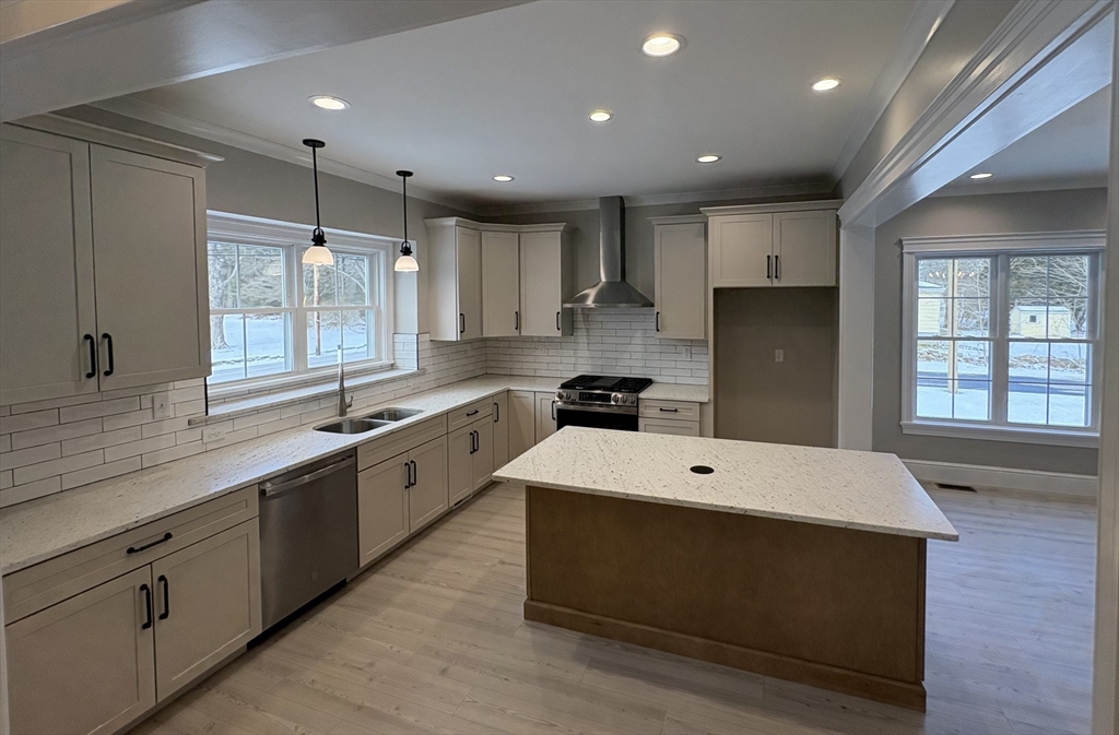 29 Range Avenue Taunton, MA 02780 - Photo 3 of 37 a large white kitchen with stainless steel appliances sink refrigerator and cabinets