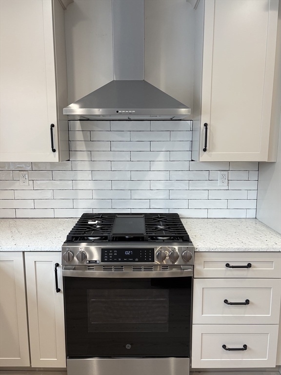 29 Range Avenue Taunton, MA 02780 - Photo 7 of 37 a kitchen with a stove and cabinets