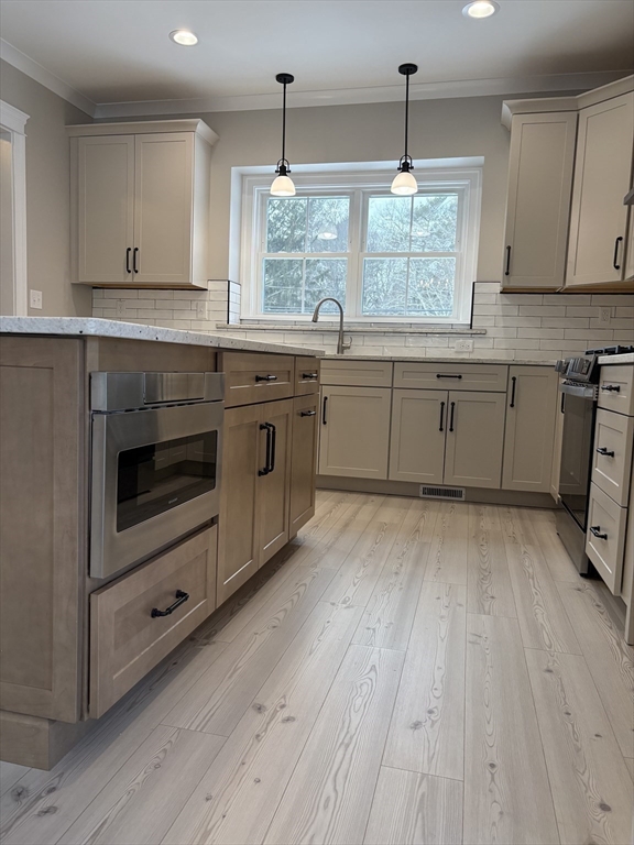 29 Range Avenue Taunton, MA 02780 - Photo 8 of 37 a kitchen with stainless steel appliances granite countertop wooden floors and sink