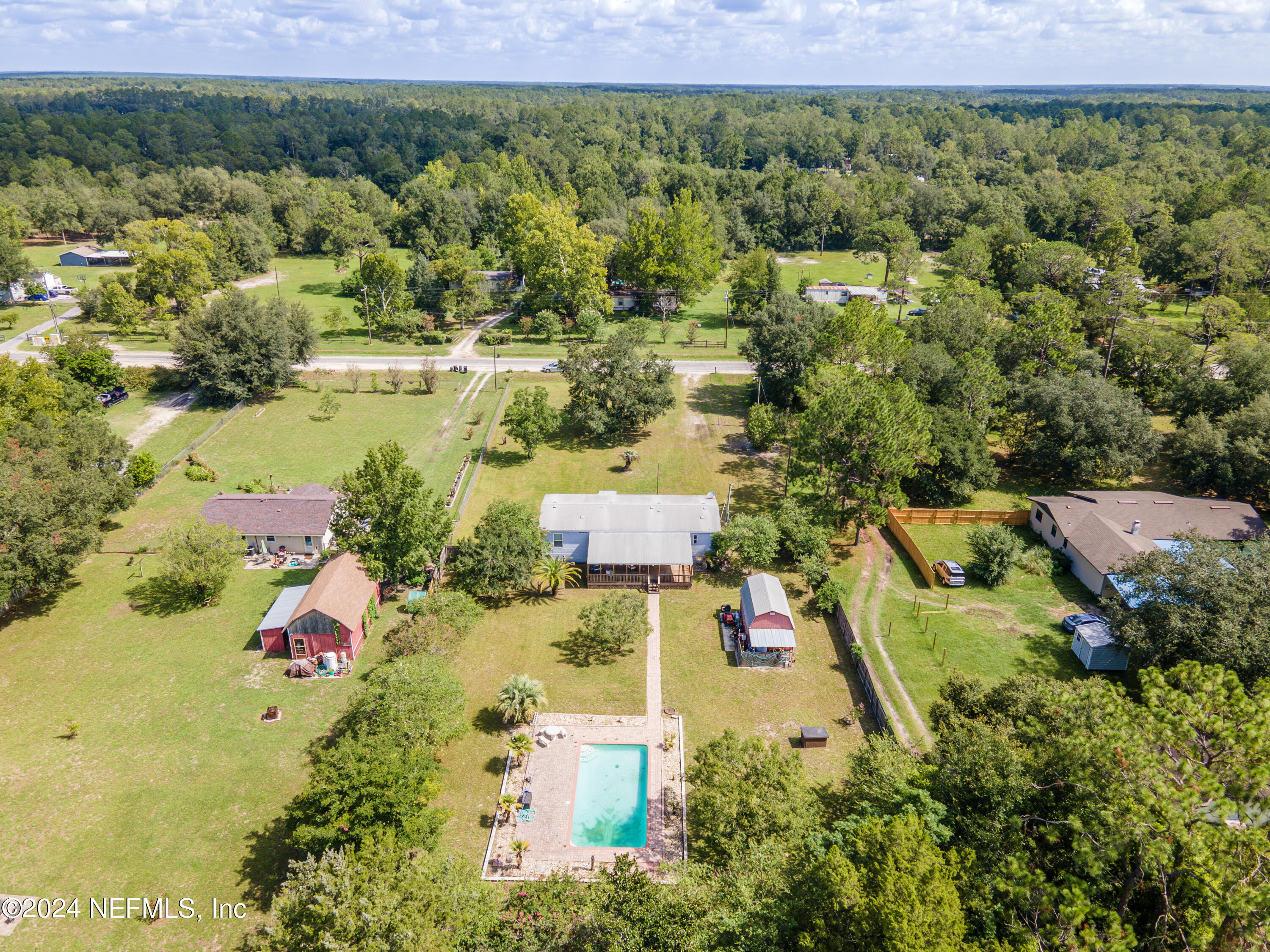 4065 Appaloosa Road Middleburg, FL 32068 - Photo 26 of 28 an aerial view of residential houses with outdoor space and trees