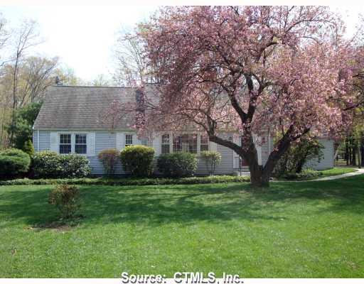 59 Wood Pond Road Farmington, CT 06032 - Photo 1 of 1 a front view of a house with a garden