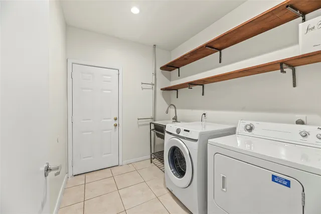a view of kitchen with furniture and refrigerator