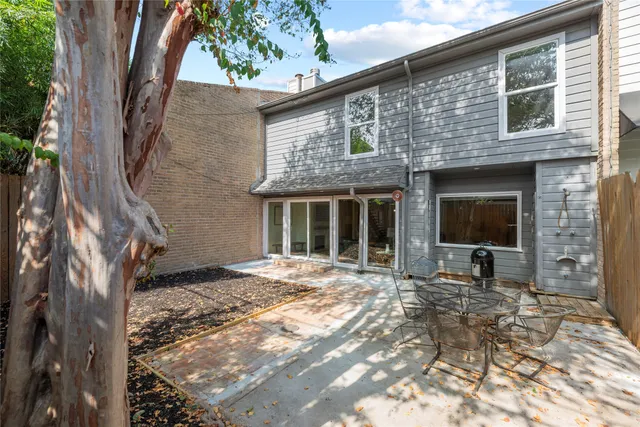 a view of house with backyard of the house