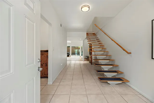 a view of entryway and hall with a window